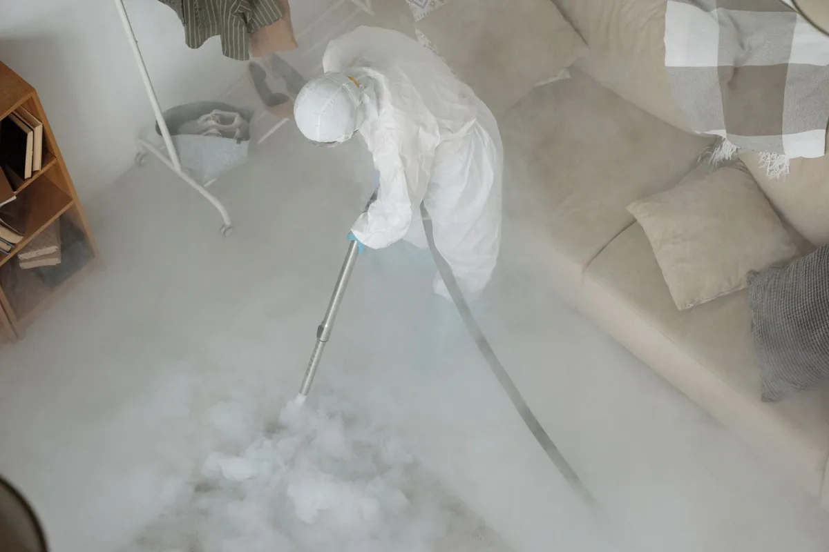 Biohazard cleanup technician in protective equipment, Paradise, CA
